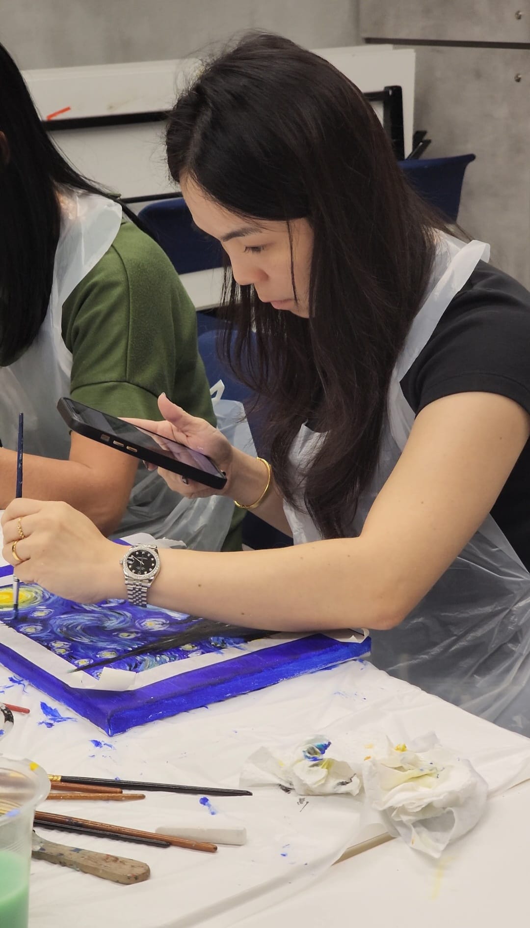 Hustle Student painting at a Starry Starry Night themed art jam